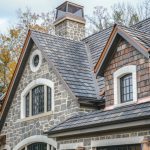 dormers_and_stone_chimneys_on_a_new_construction_architectur